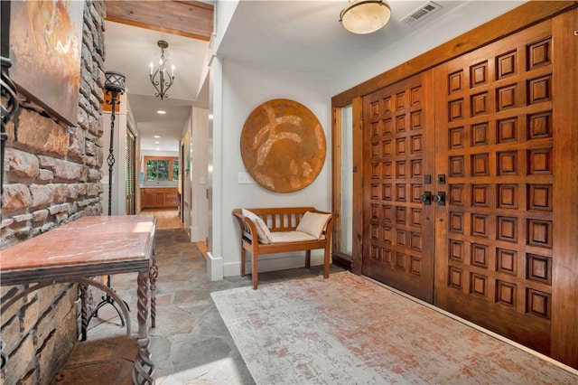 1018 N Canterbury Rd, Fayetteville, AR 72701 - foyer featuring stone flooring and a chandelier