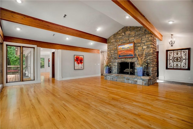 1018 N Canterbury Rd, Fayetteville, AR 72701 - unfurnished living room featuring light wood-style flooring, a fireplace, and a chandelier