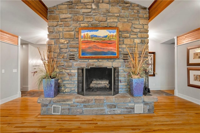 1018 N Canterbury Rd, Fayetteville, AR 72701 - unfurnished living room featuring vaulted ceiling, a fireplace, and wood finished floors