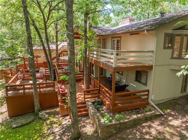 1018 N Canterbury Rd, Fayetteville, AR 72701 - back of house with a chimney and a wooden deck