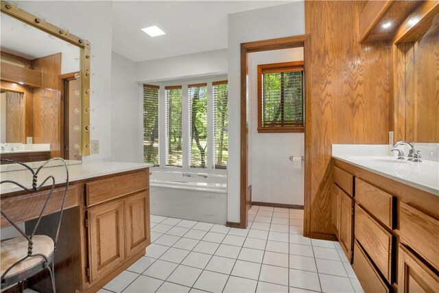 1018 N Canterbury Rd, Fayetteville, AR 72701 - bathroom featuring vanity, a garden tub, and tile patterned floors