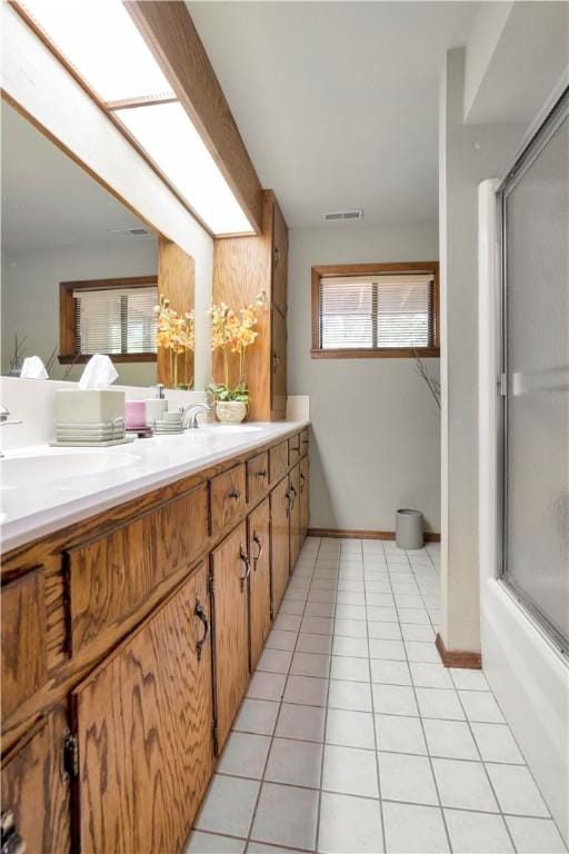 1018 N Canterbury Rd, Fayetteville, AR 72701 - bathroom featuring double vanity and tile patterned flooring