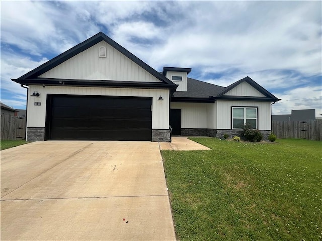 1340 Mt Hood Dr, Centerton, AR 72719 - view of front facade featuring driveway, stone siding, a garage, and a shingled roof