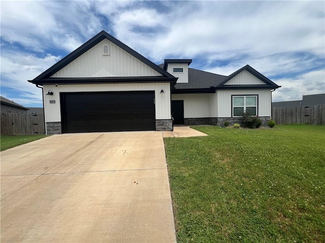 1340 Mt Hood Dr, Centerton, AR 72719 - view of front of house featuring concrete driveway, an attached garage, stone siding, and a shingled roof
