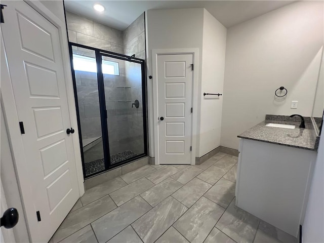 1340 Mt Hood Dr, Centerton, AR 72719 - bathroom featuring a stall shower, vanity, marble look tile flooring, and recessed lighting