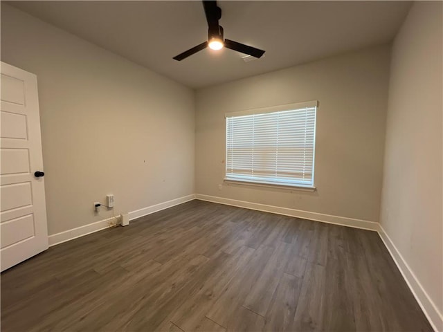1340 Mt Hood Dr, Centerton, AR 72719 - spare room featuring ceiling fan and dark wood-type flooring