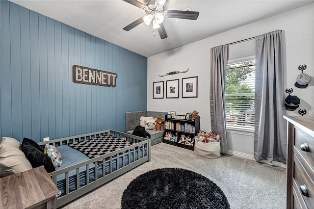 1208 Hickory St, Cave Springs, AR 72718 - bedroom featuring carpet flooring, ceiling fan, and wood walls