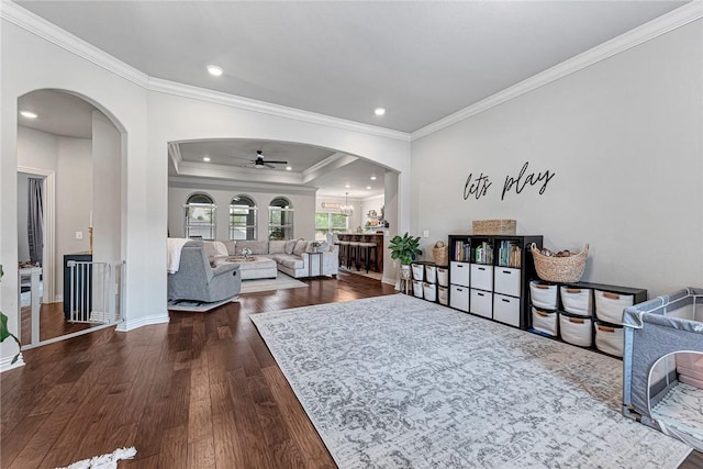 1208 Hickory St, Cave Springs, AR 72718 - living area featuring ornamental molding, ceiling fan, dark wood-style flooring, arched walkways, and recessed lighting