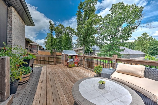 1208 Hickory St, Cave Springs, AR 72718 - wooden terrace featuring a fenced backyard