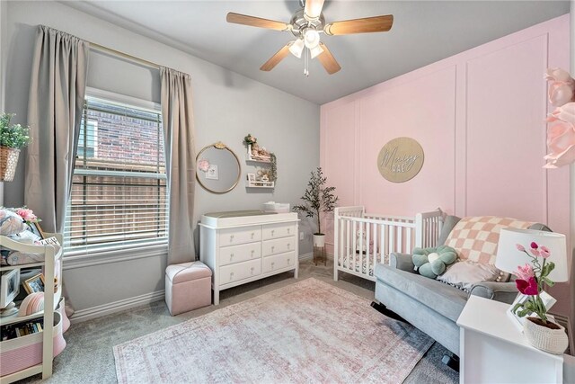 1208 Hickory St, Cave Springs, AR 72718 - carpeted bedroom with a nursery area and ceiling fan