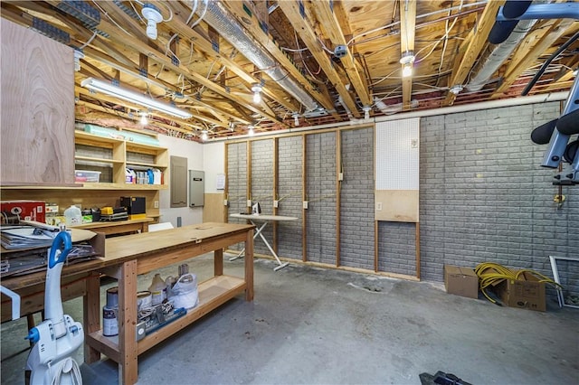161 Hillcrest Rd, Eureka Springs, AR 72631 - unfinished below grade area featuring brick wall and electric panel
