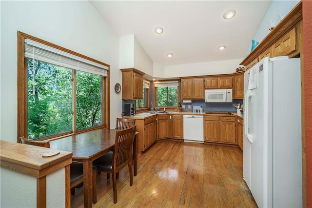 161 Hillcrest Rd, Eureka Springs, AR 72631 - kitchen featuring white appliances, plenty of natural light, light wood-style floors, brown cabinets, and recessed lighting