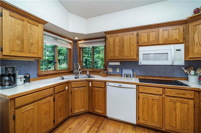 161 Hillcrest Rd, Eureka Springs, AR 72631 - kitchen featuring white appliances, tasteful backsplash, and brown cabinetry