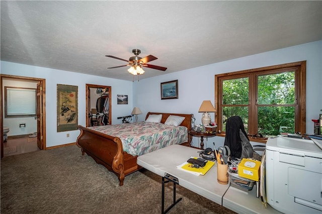 161 Hillcrest Rd, Eureka Springs, AR 72631 - carpeted bedroom with ensuite bath, ceiling fan, a closet, and a walk in closet