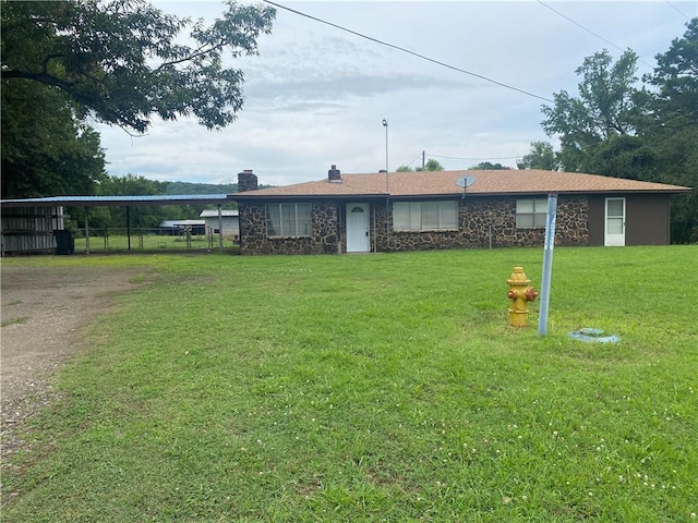 3218 Mulberry Wire Rd, Mulberry, AR 72947 - view of front facade featuring stone siding, a chimney, a detached carport, and a front yard