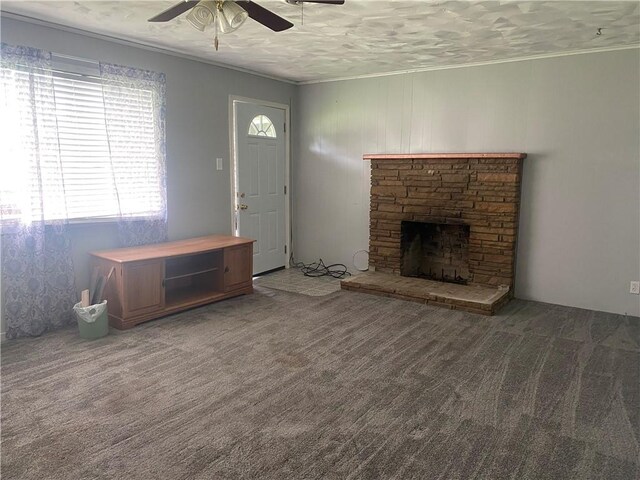 3218 Mulberry Wire Rd, Mulberry, AR 72947 - unfurnished living room featuring a ceiling fan, ornamental molding, carpet flooring, and a fireplace