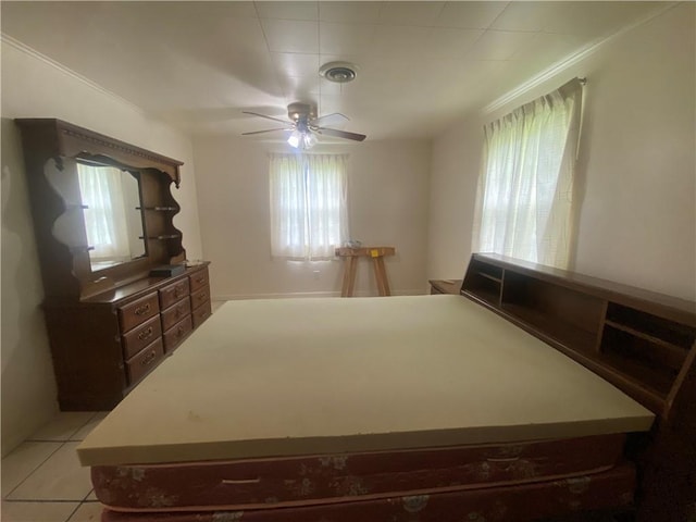 3218 Mulberry Wire Rd, Mulberry, AR 72947 - bedroom featuring multiple windows, ceiling fan, and light tile patterned flooring