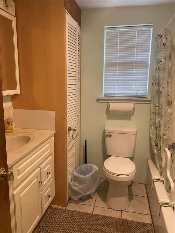 3218 Mulberry Wire Rd, Mulberry, AR 72947 - bathroom featuring vanity, tile patterned floors, shower / tub combo with curtain, and a closet