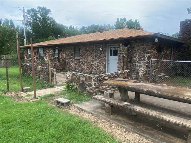 3218 Mulberry Wire Rd, Mulberry, AR 72947 - rear view of house with stone siding and roof with shingles