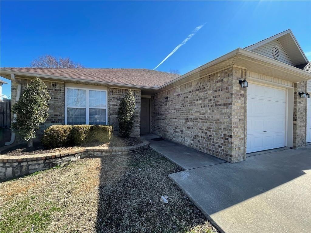2571 Mia Pl, Springdale, AR 72764 - ranch-style house featuring a garage, brick siding, and a shingled roof