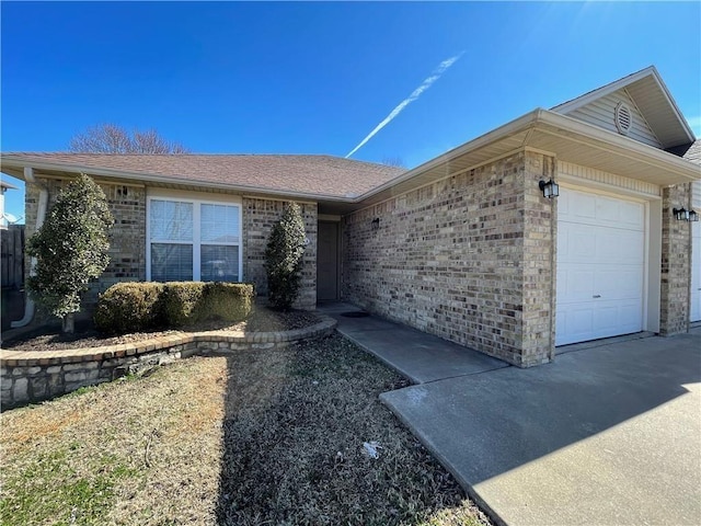 2571 Mia Pl, Springdale, AR 72764 - ranch-style house featuring a garage, brick siding, and a shingled roof