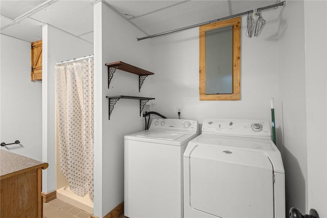 16590 Roughton Ln, Pea Ridge, AR 72751 - washroom featuring washing machine and clothes dryer and light tile patterned floors