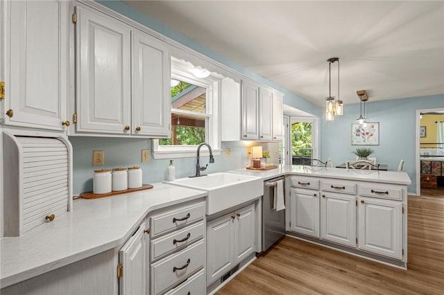 16590 Roughton Ln, Pea Ridge, AR 72751 - kitchen featuring dishwasher, a peninsula, white cabinets, and plenty of natural light