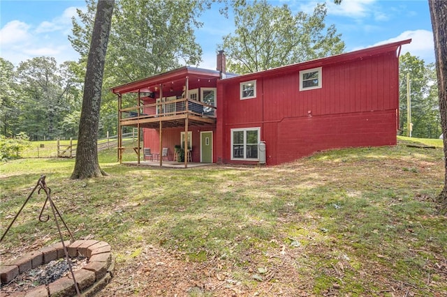 16590 Roughton Ln, Pea Ridge, AR 72751 - rear view of house featuring a yard, a deck, and a patio area