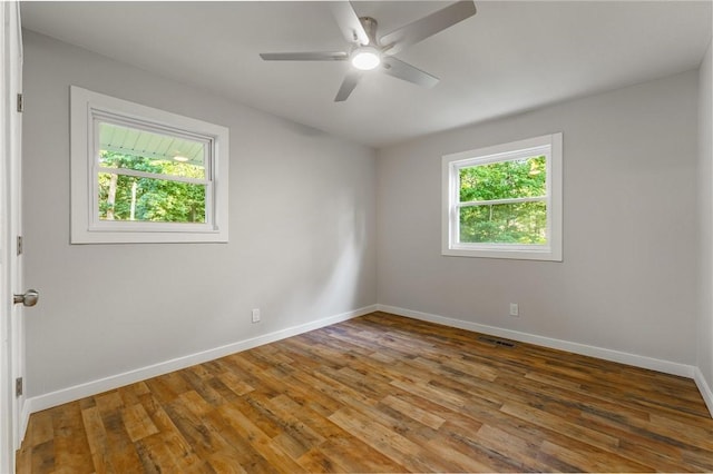 2 Rochdale Dr, Bella Vista, AR 72714 - unfurnished room with wood finished floors and a ceiling fan
