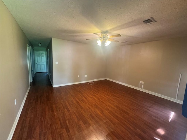 116 Autumn Cv, Searcy, AR 72143 - empty room with dark wood-style flooring, ceiling fan, and a textured ceiling