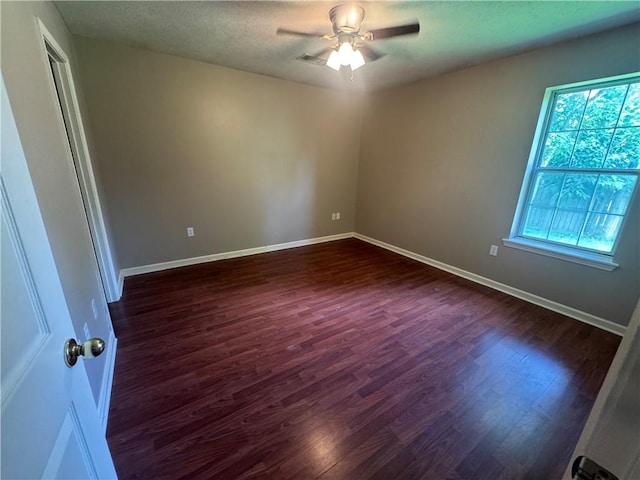 116 Autumn Cv, Searcy, AR 72143 - unfurnished room with dark wood finished floors, a ceiling fan, and a textured ceiling