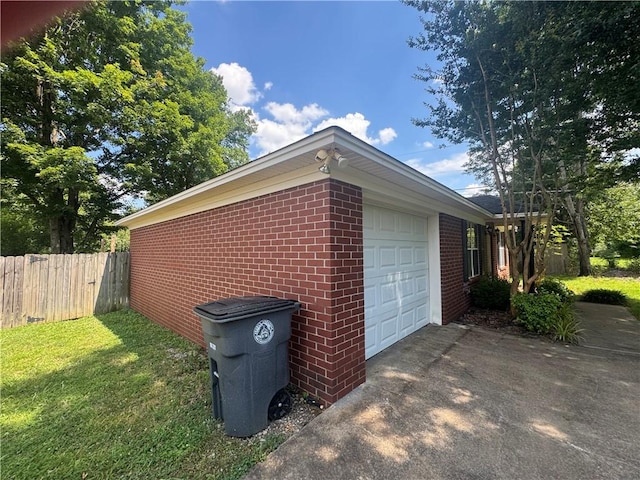 116 Autumn Cv, Searcy, AR 72143 - view of side of property with an attached garage, brick siding, and driveway