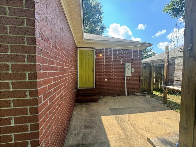 116 Autumn Cv, Searcy, AR 72143 - doorway to property with a patio and brick siding