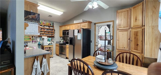 1210 Spring St, Bentonville, AR 72712 - kitchen with appliances with stainless steel finishes, vaulted ceiling, ceiling fan, and light brown cabinetry