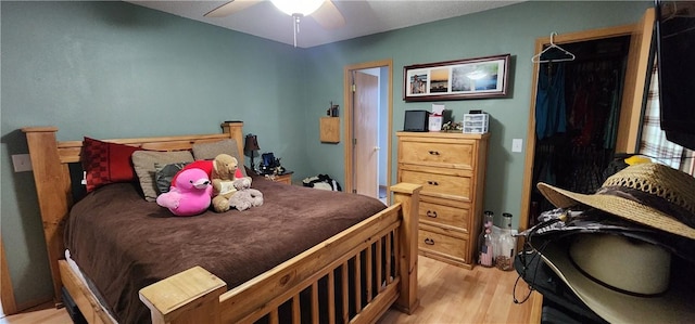 1210 Spring St, Bentonville, AR 72712 - bedroom with light wood-style floors and ceiling fan