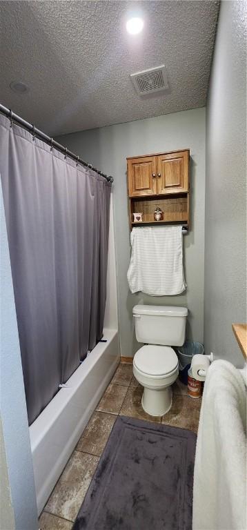 1210 Spring St, Bentonville, AR 72712 - full bathroom with shower / tub combo with curtain and a textured ceiling