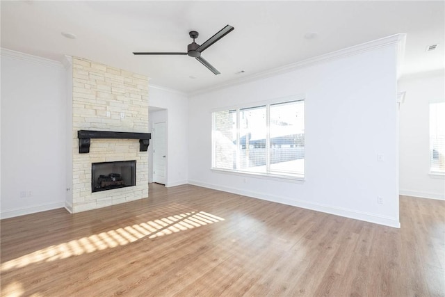 1355 NE Pershing St, Fayetteville, AR 72704 - unfurnished living room with ceiling fan, wood finished floors, a stone fireplace, and crown molding
