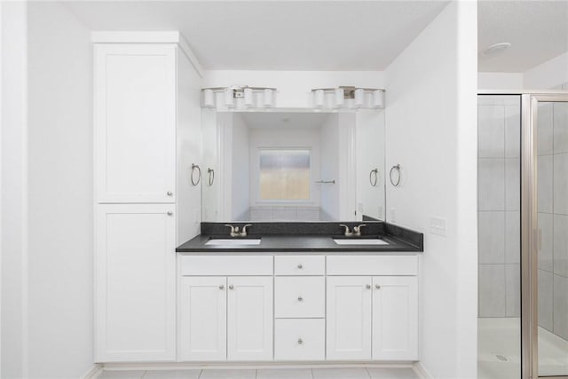 1355 NE Pershing St, Fayetteville, AR 72704 - full bathroom featuring a shower stall, double vanity, and tile patterned flooring
