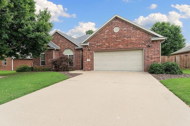 1409 S Breckenridge Loop, Rogers, AR 72756 - view of front facade with a garage, driveway, and brick siding