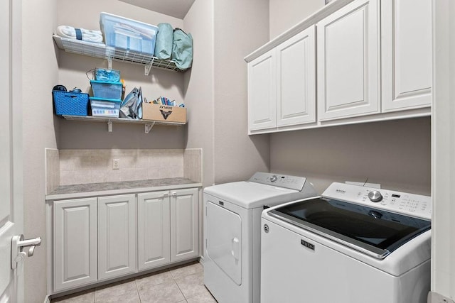 1409 S Breckenridge Loop, Rogers, AR 72756 - washroom with separate washer and dryer, cabinet space, and light tile patterned flooring