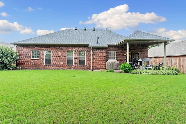 1409 S Breckenridge Loop, Rogers, AR 72756 - rear view of property featuring brick siding, a shingled roof, and a patio