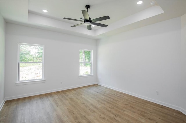 7 Consett Ln, Bella Vista, AR 72714 - empty room with a raised ceiling, light wood-type flooring, a smoke detector, recessed lighting, and ceiling fan