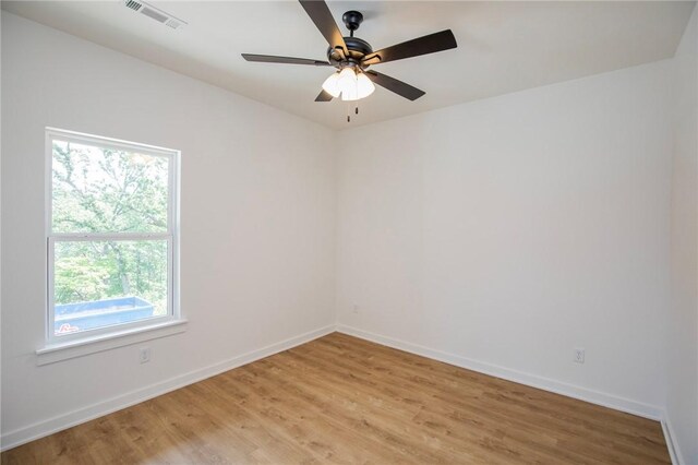 7 Consett Ln, Bella Vista, AR 72714 - unfurnished room featuring light wood-type flooring and a ceiling fan