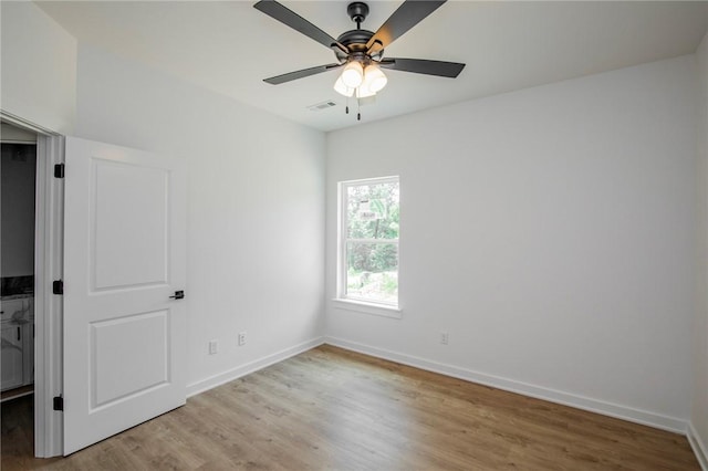 7 Consett Ln, Bella Vista, AR 72714 - empty room with light wood-type flooring and ceiling fan