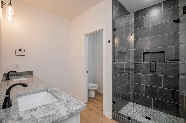 7 Consett Ln, Bella Vista, AR 72714 - full bath with a stall shower, double vanity, and wood finished floors