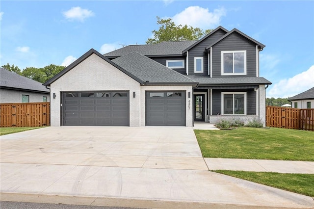 8607 W Feathered Nest Run, Bentonville, AR 72713 - view of front of property featuring an attached garage, driveway, brick siding, and roof with shingles