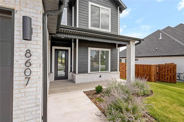 8607 W Feathered Nest Run, Bentonville, AR 72713 - doorway to property featuring brick siding