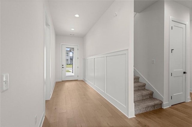 8607 W Feathered Nest Run, Bentonville, AR 72713 - hall featuring light wood-type flooring, recessed lighting, and stairs