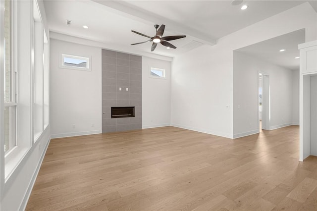 8607 W Feathered Nest Run, Bentonville, AR 72713 - unfurnished living room featuring a ceiling fan, light wood-style flooring, recessed lighting, a fireplace, and beam ceiling