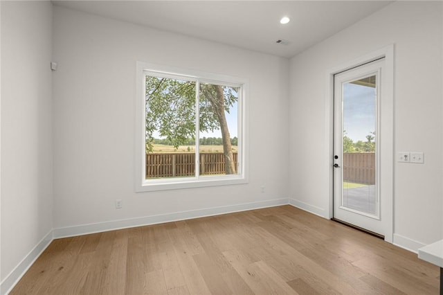 8607 W Feathered Nest Run, Bentonville, AR 72713 - empty room featuring light wood-style floors and recessed lighting